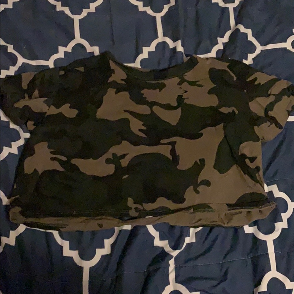 Crop topped, ripped, camouflage tee.